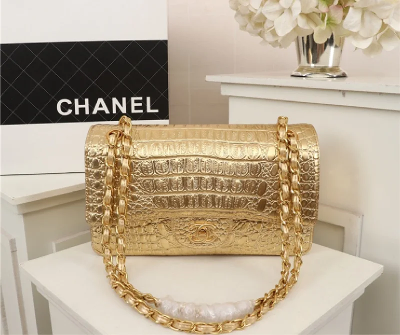 Gold Chanel woman shoulder handbag